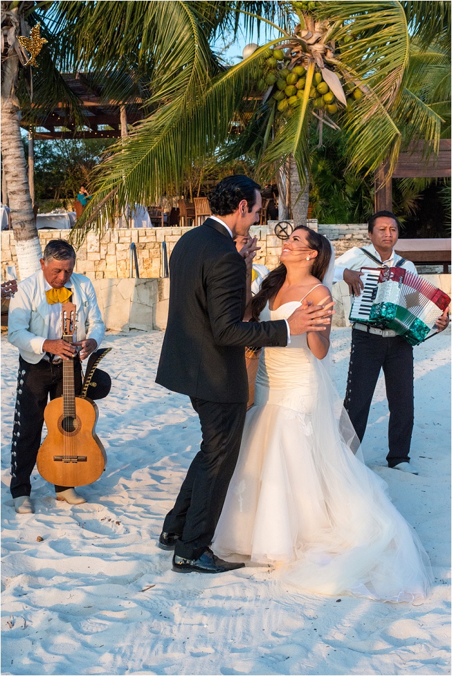 Bride and groom dancing with Mexican band