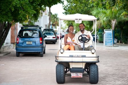 Bride and groom in golf cart