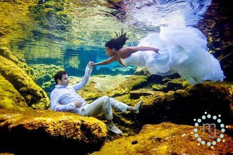 Underwater photography of bride and groom