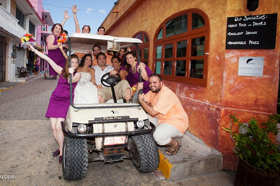 Wedding party in golf cart